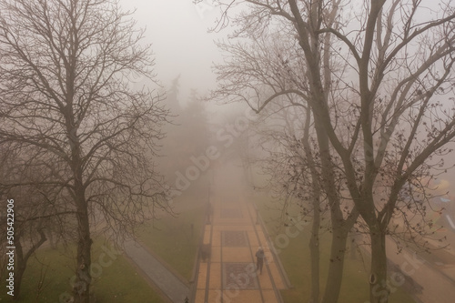 Volodymyr's Hill or St. Vladimir's Hill in the morning in fog, is a large park located on the steep right bank of the Dnieper in the center of Kyiv, the capital of Ukraine. photo