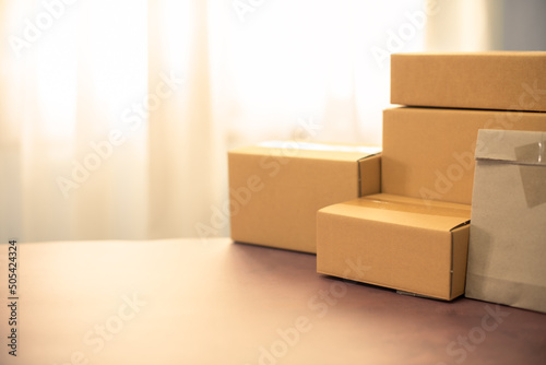 Lot of brown cardboard boxes copy space on table warehouse delivery service shipment goods. cardboard parcel box of product for deliver to customer. Online selling, e-commerce, packing concept.