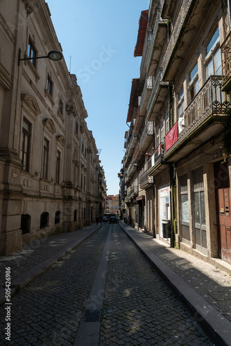 Fototapeta Naklejka Na Ścianę i Meble -  Streets of the city center of Porto on a sunny day in summer 2022.