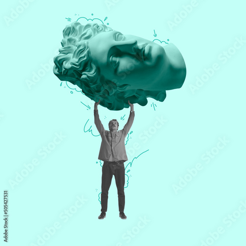 Contemporary art collage. Young man carries a huge ancient statue head isolated on light background. Concept of art, creativity, retro style, surrealism photo