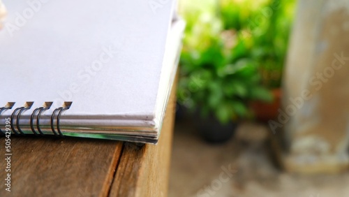 book handmade on the wooden table, book on nature background