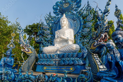 Canvas Print white buddha on a blue background meditating at Wat Rong Suea Ten Chiang Rai