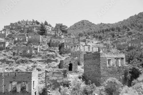 Grayscale shot of Kayakoy, an abandoned village in southwest Turkey. photo