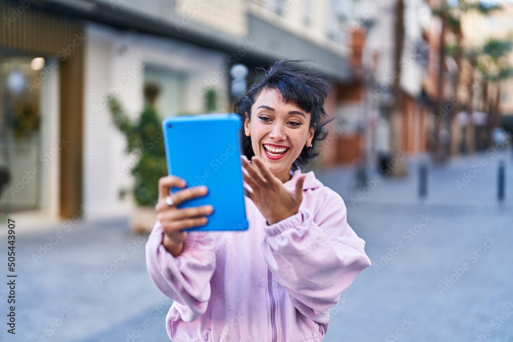 Young woman smiling confident having video call at street Young woman smiling confident having video call at street
