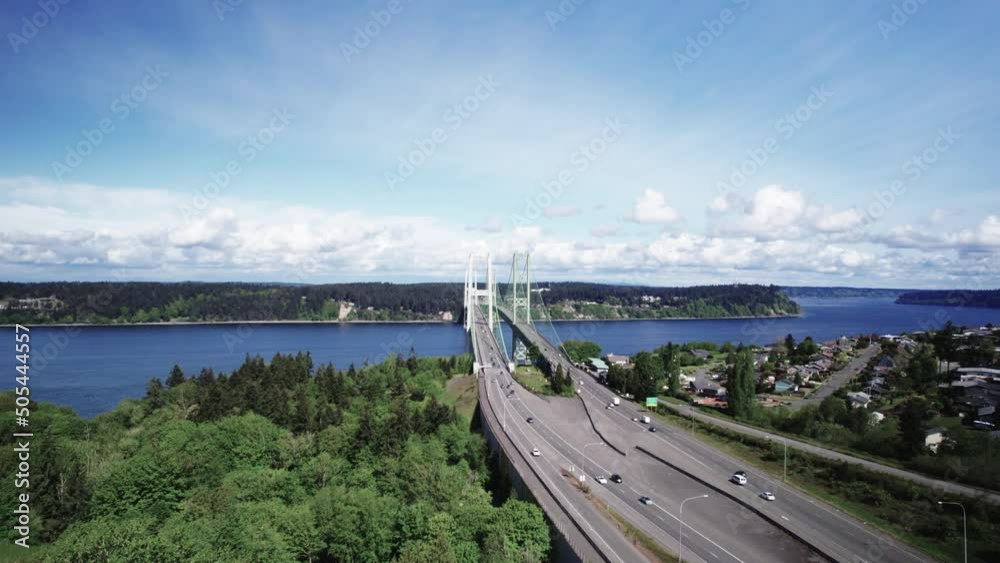 Daily commuters travel across the Tacoma Narrows Bridge, crossing Puget Sound, aerial Daily commuters travel across the Tacoma Narrows Bridge, crossing Puget Sound, aerial
