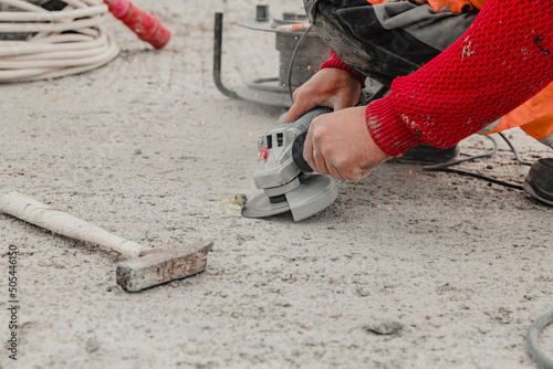 Closeup shot of a hands doing installation work during construction photo