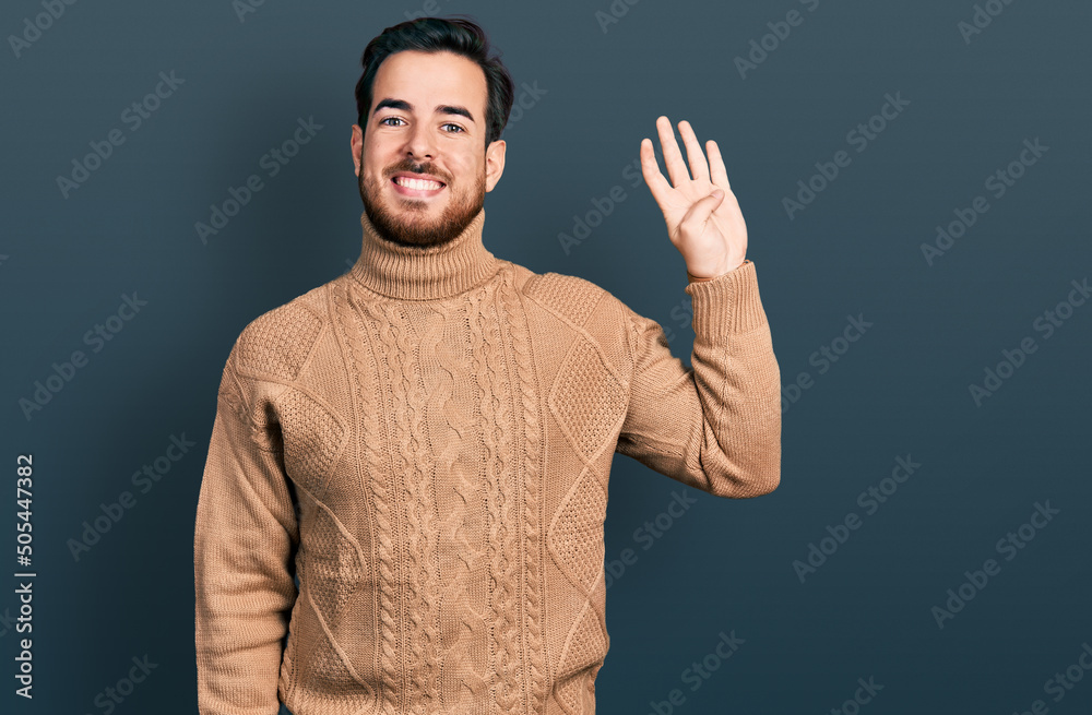 Young hispanic man wearing casual clothes showing and pointing up with fingers number four while smiling confident and happy. Young hispanic man wearing casual clothes showing and pointing up with fingers number four while smiling confident and happy.