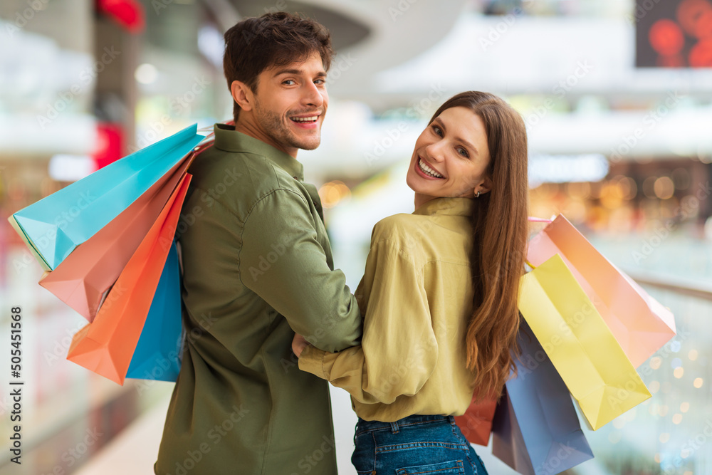 Married Couple Enjoying Shopping Walking In Hypermarket Indoors Married Couple Enjoying Shopping Walking In Hypermarket Indoors