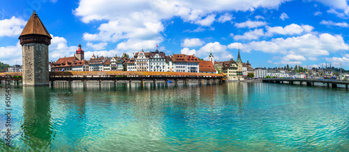 Fényképezés Panoramic view of Lucerne (Luzern) town with famous Chapel wooden bridge over Reuss river