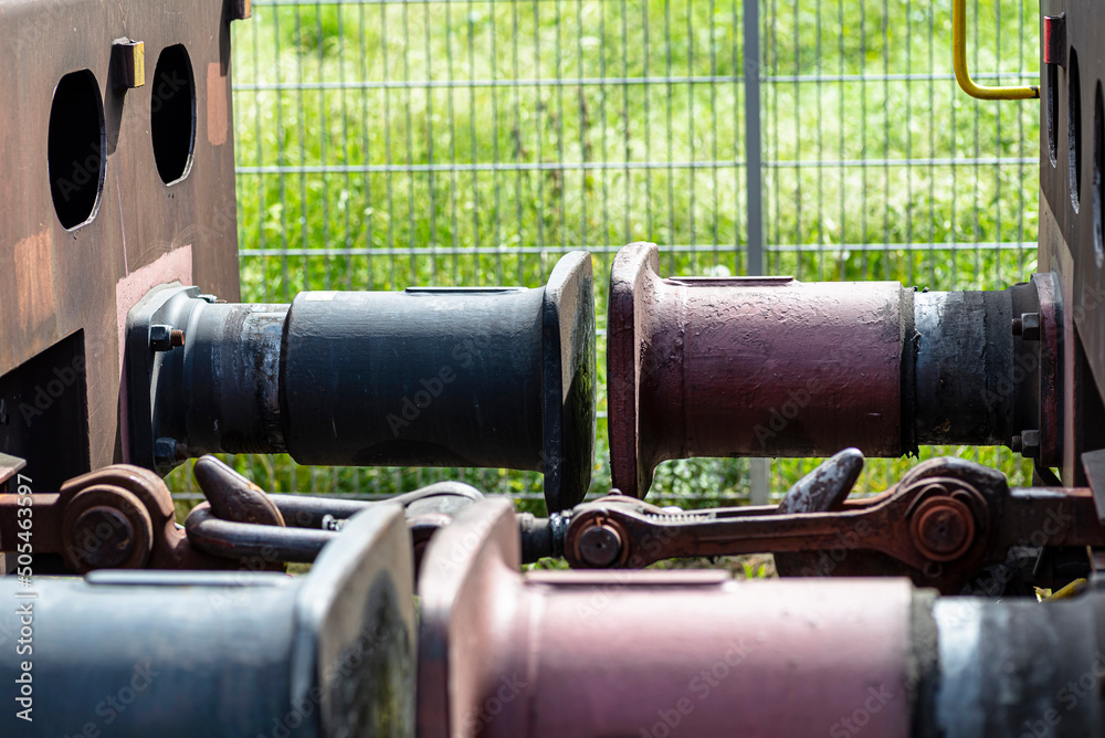 Chain coupler connecting freight wagons, large wagon buffers visible