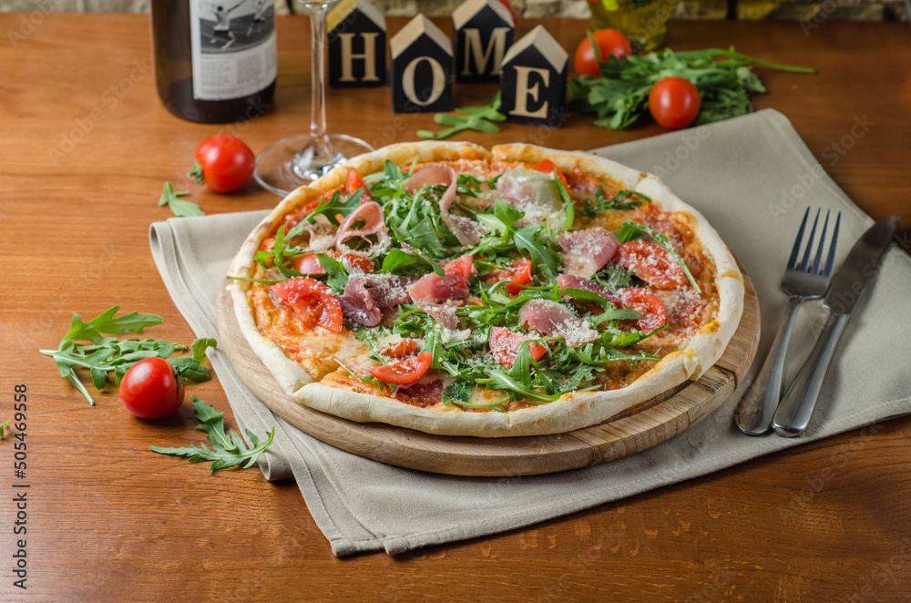 Pizza with Parma ham and arugula