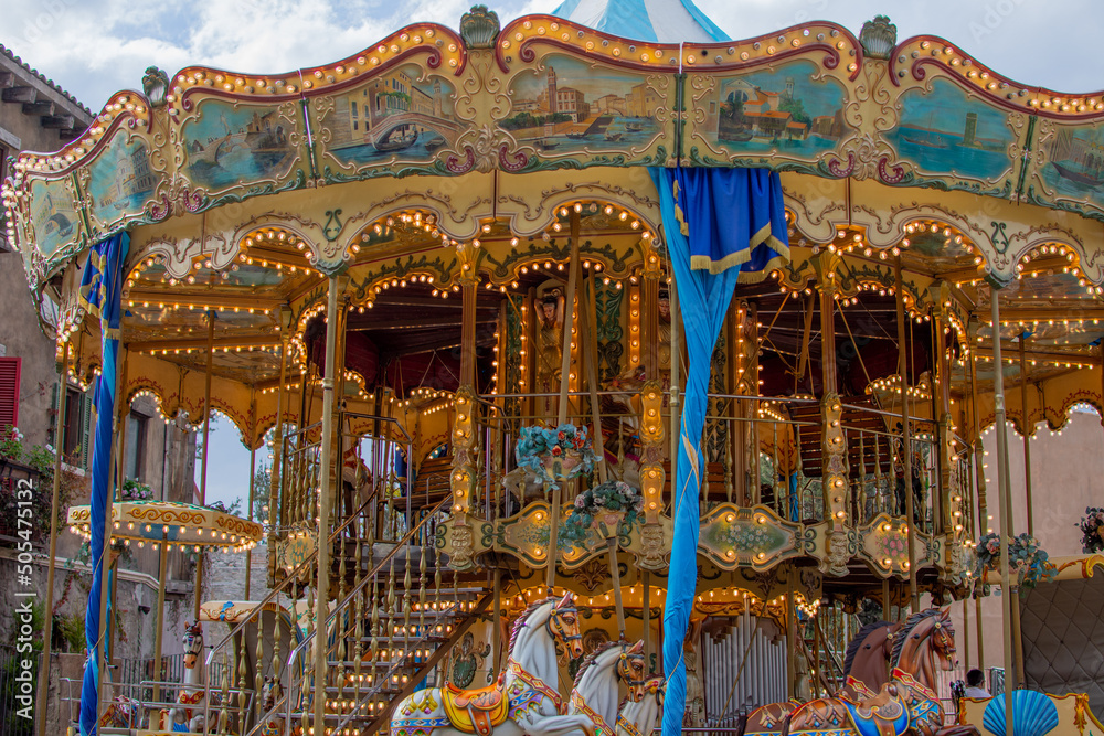 Texas Cavael Rides Colorful Carousel Attraction Ride With Wooden Horses in an Italian ...