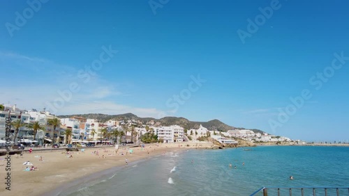 POV view towards an open space of San Sebastian beach in Sitges, Costa Dorada, Spain photo