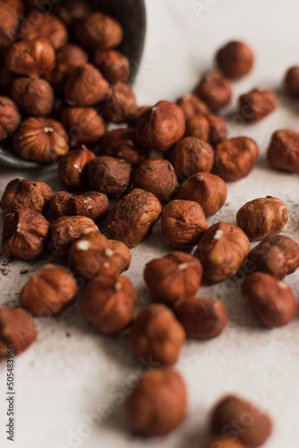 pile of raw hazelnut on white background