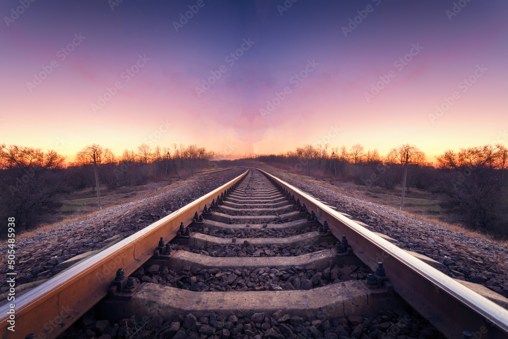 Train platform at sunset. Railroad. Railway station Train platform at sunset. Railroad. Railway station