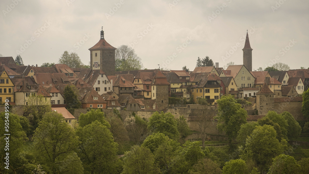 Rothenburg, Franconia / Germany - May 05. 2022: Panorama of the historic old town of Rothenburg ob der Tauber with Siebersturm and well-preserved city wall Rothenburg, Franconia / Germany - May 05. 2022: Panorama of the historic old town of Rothenburg ob der Tauber with Siebersturm and well-preserved city wall