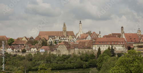 Rothenburg, Franconia / Germany - May 05. 2022: Panorama of the historic old town of Rothenburg ob der Tauber with Sankt Jakobs Kirche, town gates, towers, half-timbered houses and town wall