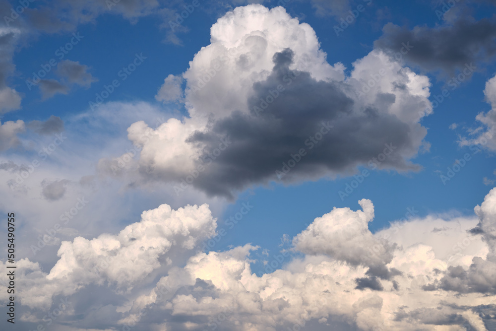 Dramatic stormy dark and light clouds before rain, blue sky white clouds as background pattern wallpaper Dramatic stormy dark and light clouds before rain, blue sky white clouds as background pattern wallpaper