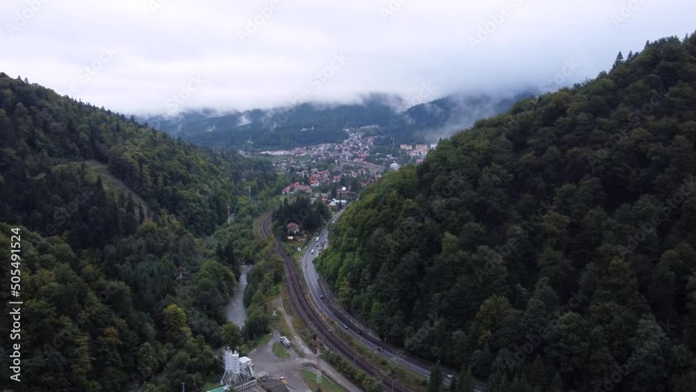 Aerial view of a foggy morning close to the railways tracks,roads and small city Aerial view of a foggy morning close to the railways tracks,roads and small city