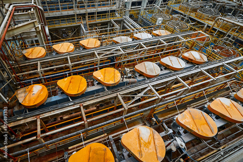 Set of floatation machines separating mineral ore at plant photo