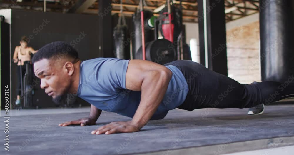 Video of african american fit man doing push ups at gym Video of african american fit man doing push ups at gym