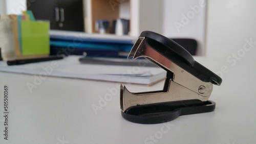 Fotografie black staple remover on the office desk