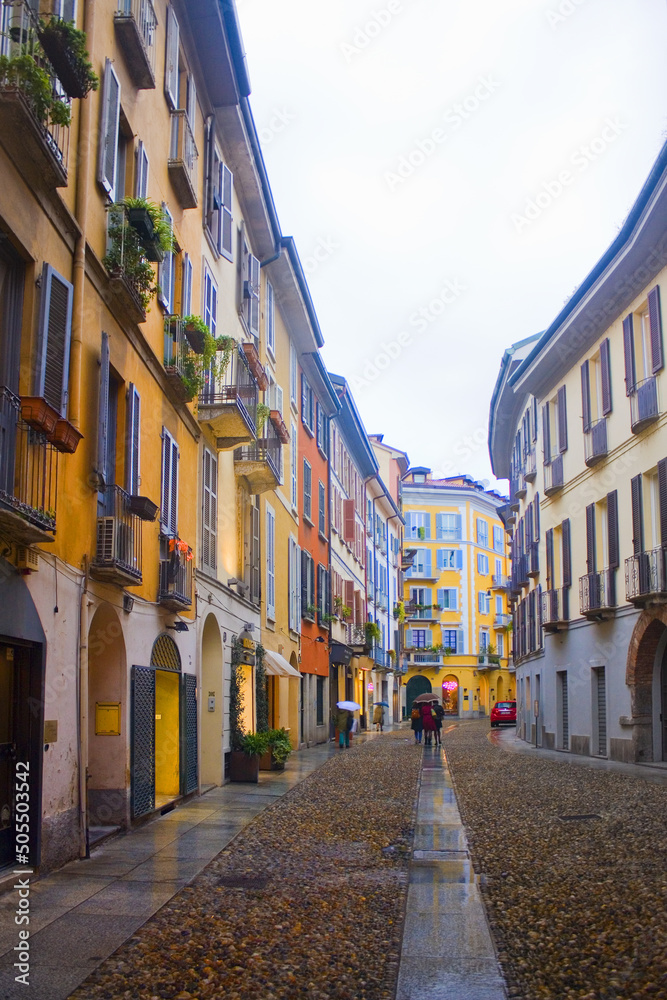 Typical street of Brera neighborhood with shops in Milan, Italy
