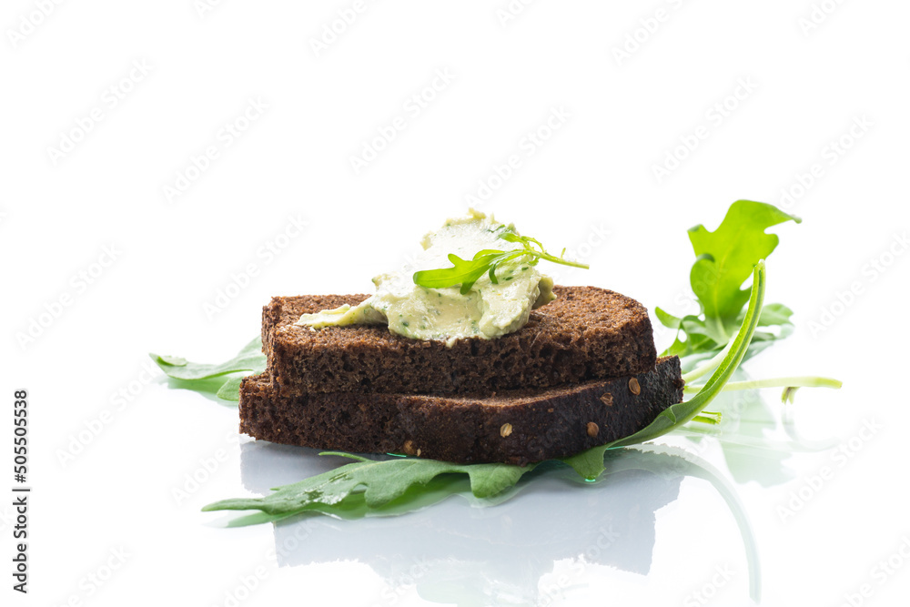 bread cheese spread with garlic and arugula on dark bread bread cheese spread with garlic and arugula on dark bread