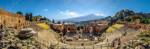 Beautiful view of the Ancient theater of Taormina with Mount Etna in the background, Sicily, Italy