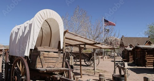Bluff Fort Southern Utah pioneer wagon cabins flag. Southern Utah pioneer town. Settled by Mormon immigrants. Dry desolate desert. Fort built for protection from Indian raids. photo