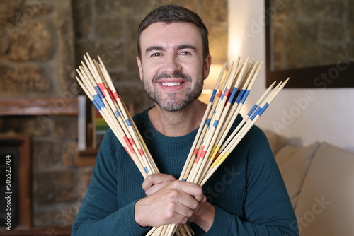 Man holding some mikado sticks photo