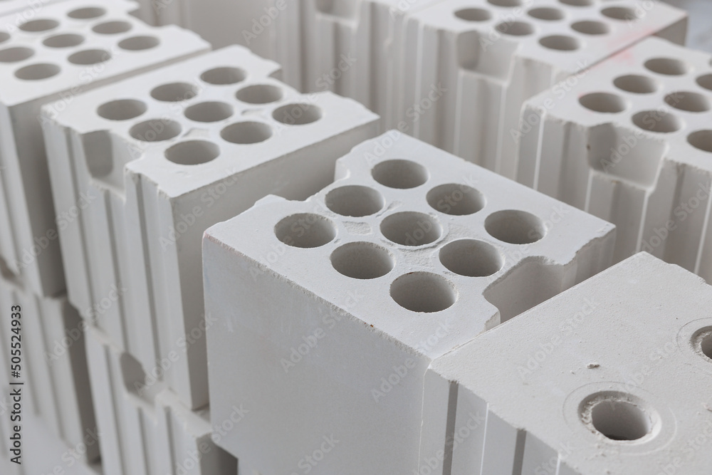 Fotografia white silicate brick with holes is stacks