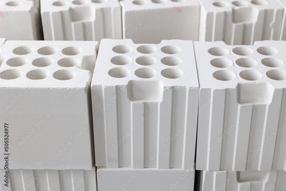 Fotografie White lightweight calcium silicate bricks piled high in a stack