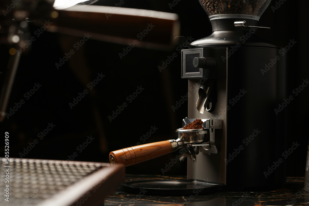 Fotografie Coffee grinder machine grinding coffee