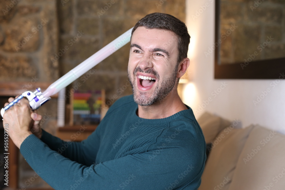 Naklejka premium Man holding a laser sword
