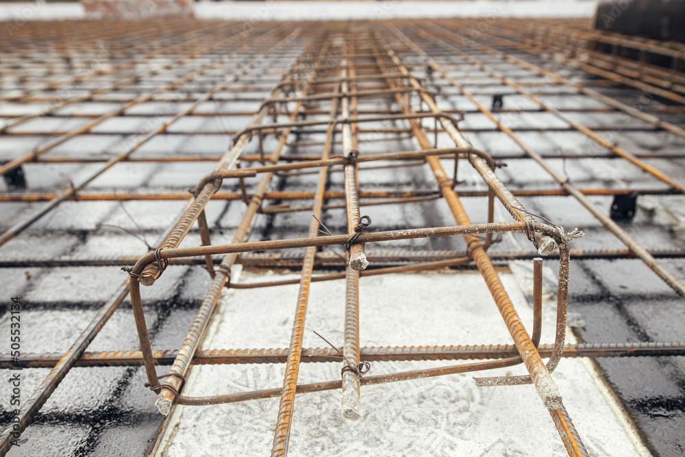 Steel rebar mesh close up. Reinforcement rods at construction site