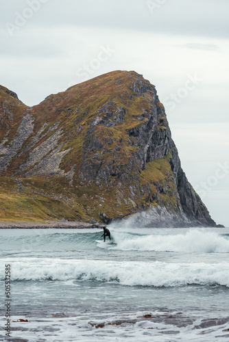 Surfing where the mountains meet the ocean photo