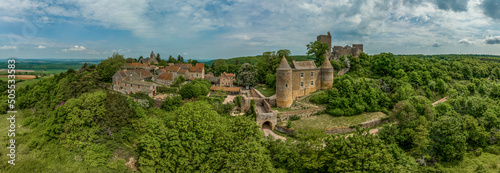 Aerial view of Brancion castle and medieval village in Burgundy France with square keep, ruined palace building and encircling medieval walls photo