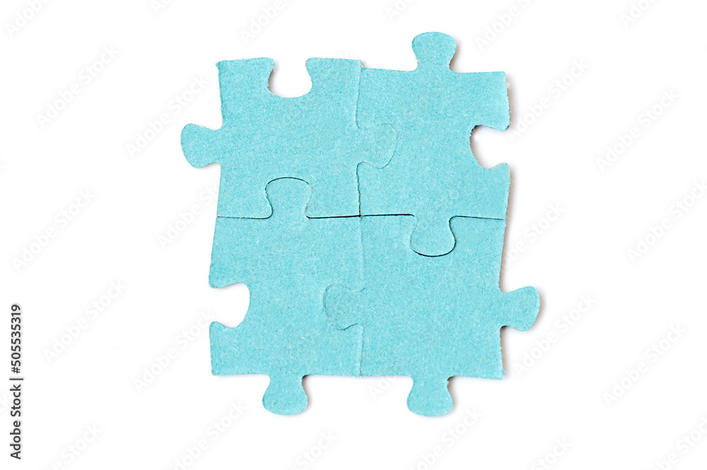 Four puzzle pieces are connected together isolated on a white background. Teamwork concept Four puzzle pieces are connected together isolated on a white background. Teamwork concept