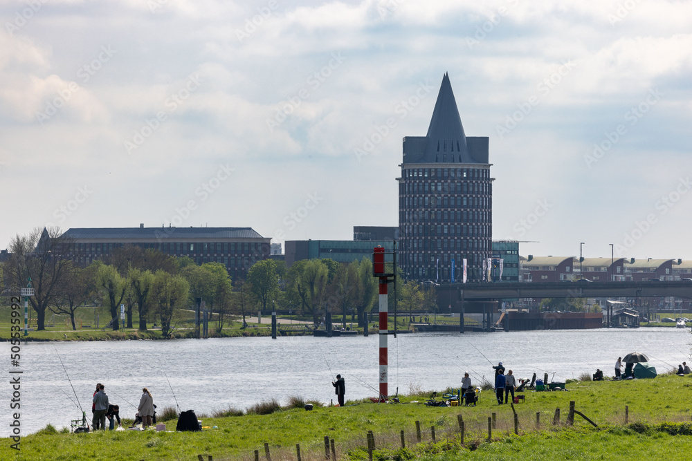 Φωτογραφία River Maas with buildings in the city of Roermond, Netherlands in the background