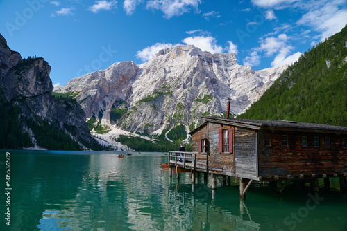 View of famous Lake  Braies in the Italian Dolomites with old boathouse and boat Fototapeta