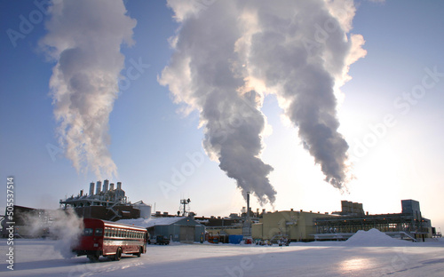 North slope processing plant emitting steam from stacks Alaska