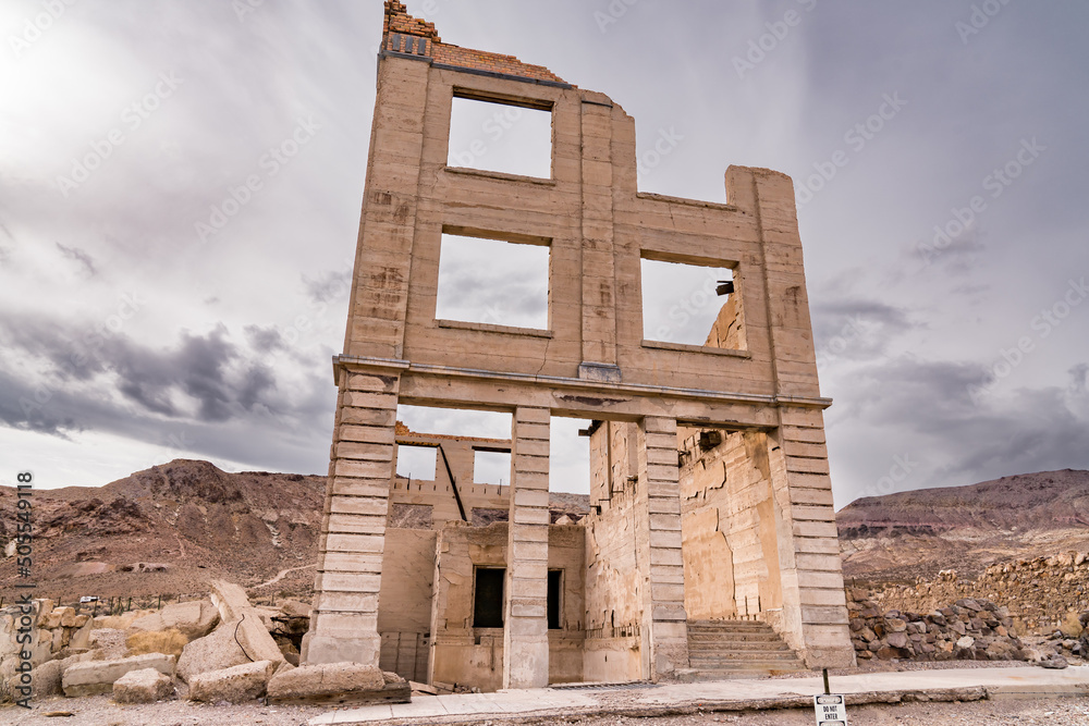Ghost town ruins of abandoned buildings in the old boom town of Rhyolite, Nevada