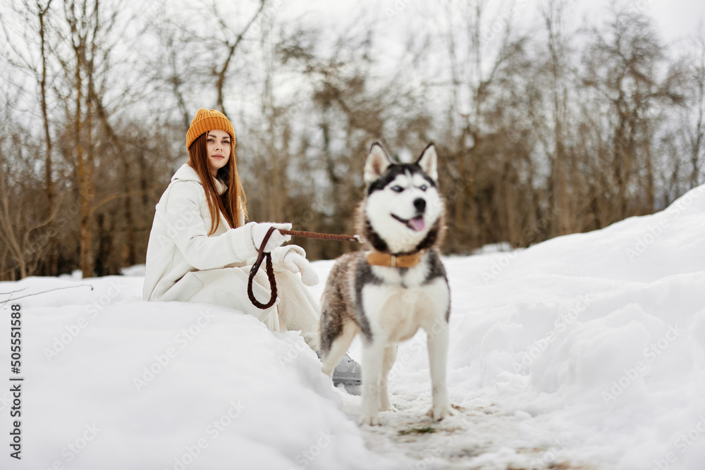 portrait of a woman winter outdoors with a dog fun nature winter holidays