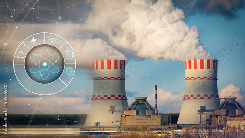 Foto Nuclear power plant cooling tower with digital icons of profit use nuclear energy