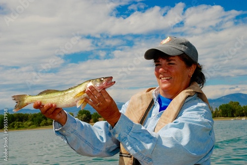 A female angler with a walleye photo