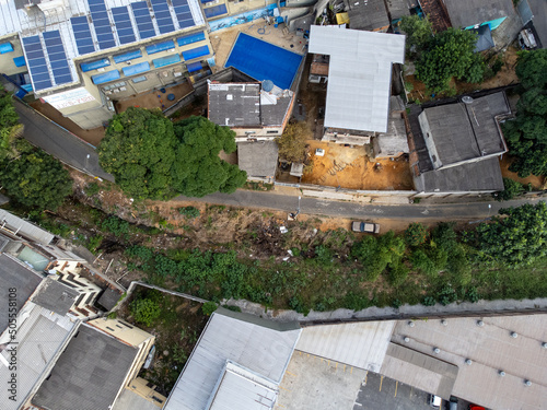 Slum favela-style community city on the outskirts of Vitoria, Cariacica, Espirito Santo - aerial drone view © Rodrigo