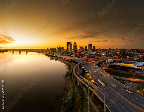 Aerial scene of night long exposure of a bridge over water with cars in Louisville, Kentucky, USA