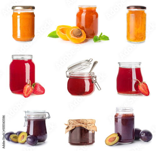 Set of jars with sweet jams on white background photo