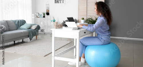 African-American woman sitt...